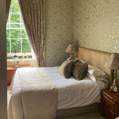 a fancy bedroom at the stables birr guesthouse